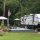 Seasonal RV site with patio and wooded surroundings at Gateway Park Campground